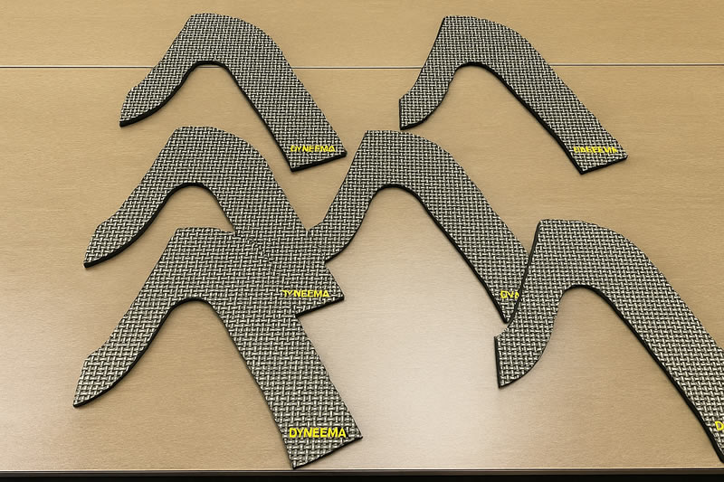 裁切完成的 Dyneema 防護件，曲線輪廓邊緣乾淨